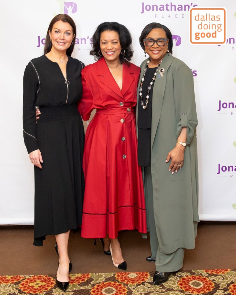 Cynt posing with two women